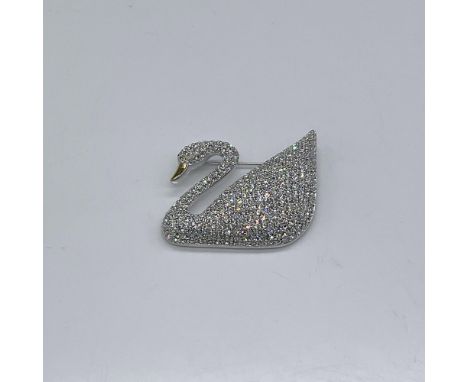 This stunning pin was hand-crafted to celebrate Swarovski's one hundredth anniversary. The swan is covered in crystals and ha