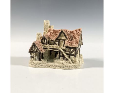 This beautiful warm intricate cottage figurine features and impressed artist signature and was made in 1983 out of ceramic an