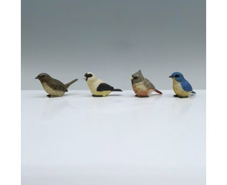 A set of four Treasures Box figurines that include a cardinal, bluebird, goldfinch, and wren resting on their feet, each desi