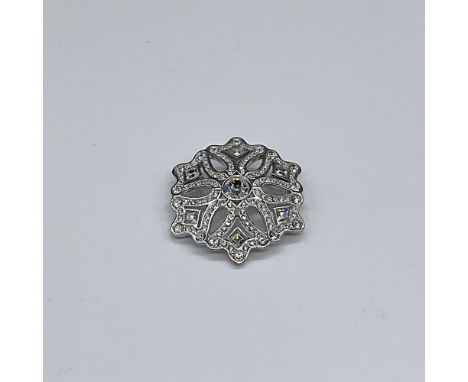 Stunning clear crystal pin set in rhodium with large octagon faceted crystal anchoring pave rhinestone crystal branches. Swar