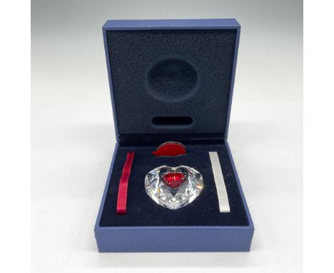 Elegant clear crystal heart with embedded red heart and 2 satin ribbons. Swarovski backstamp. 629510. This item has its origi