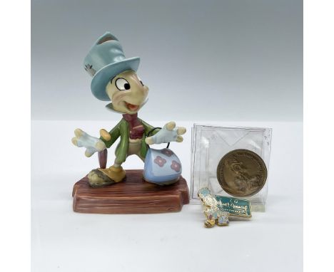 Jiminy Cricket, standing with a spring in his step, gracefully holds his umbrella down. Walt Disney Classics backstamp. This 
