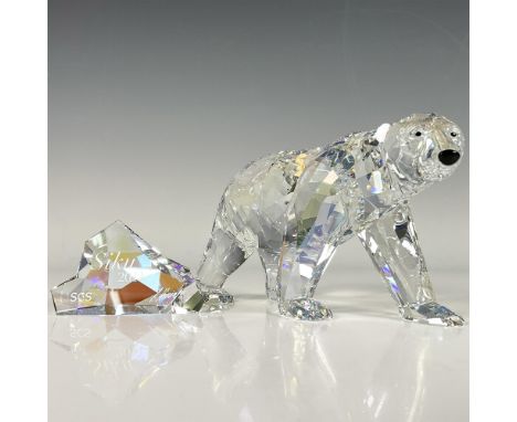 A 2011 annual edition of an Artic bear in moonlight colored crystal with black crystal eyes and nose. Includes an iceberg for