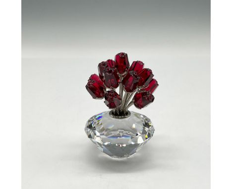 Decor item is a commemorative piece reflecting 15 years of SCS with 15 red crystal roses on rhodium stems presented in clear 