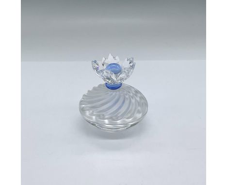 The bottom bowl is clear crystal. The removable lid is frosted with a beautiful faceted flower with a blue stone in it's cent
