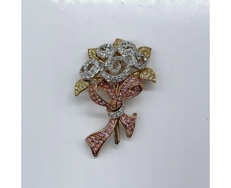 This 1998 annual edition joins two symbols of compassion, the bouquet and the ribbon. The crystal flowers are tied together w