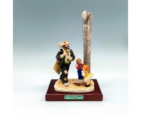 Part of the Day At The Fair Collection, matte finished figural holding sledge hammer standing in front of scale with children