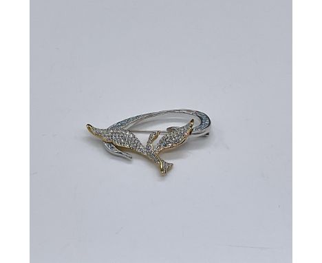 1999 Annual Edition Pin. Clear and light blue crystals adorn this beautiful dove. This item has its original box. Measures 3.