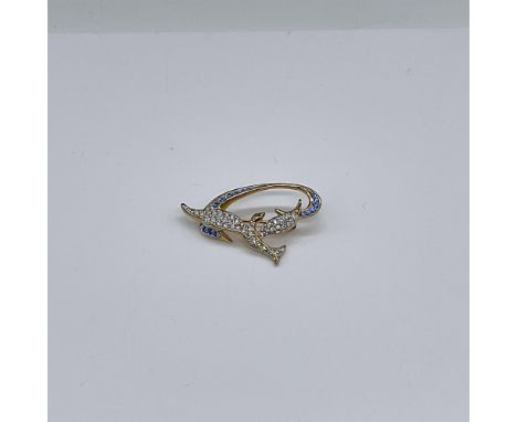 Created as a memorial pin for the victims of 9/11. Beautiful gold pin decorated with clear and blue crystals, displays an ima
