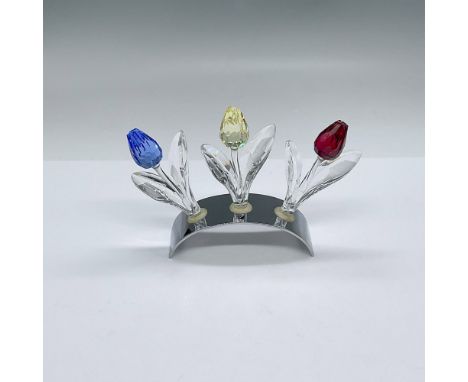 A chrome arched base to display the 3 Swarovski renewal gifts; a 2002 blue tulip, a 2003 red tulip, and a 2004 yellow tulip. 