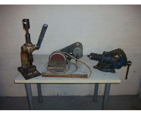 AN ENGINEER'S SWIVEL VICE, A HAND PRESS AND A POWERED SANDER