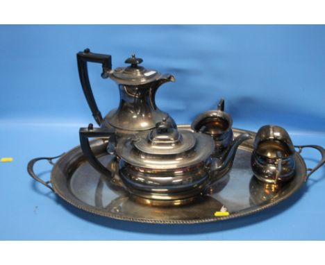 A HALLMARKED SILVER TEA SET ON TRAY COMPRISING TEAPOT, HOT WATER JUG, MILK AND SUGAR