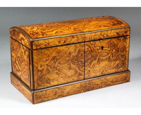 A fine early 19th Century brass inlaid kingwood and satin birch tea caddy with domed top by Thomas Lund of London, the exteri