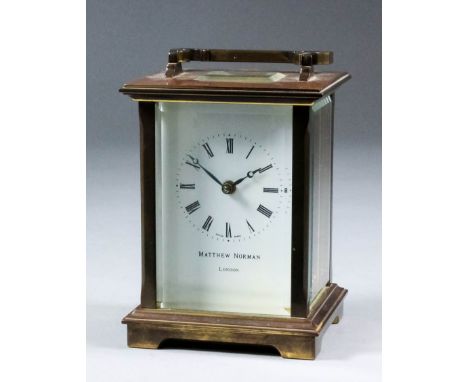 A modern carriage clock by Matthew Norman of London, No. 1754, the white enamel dial with Roman numerals, to the eight day si