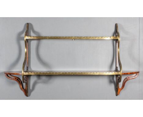 A 19th Century rosewood and brass mounted bow fronted two-tier wall shelf of shaped outline with pierced brass gallery to fro