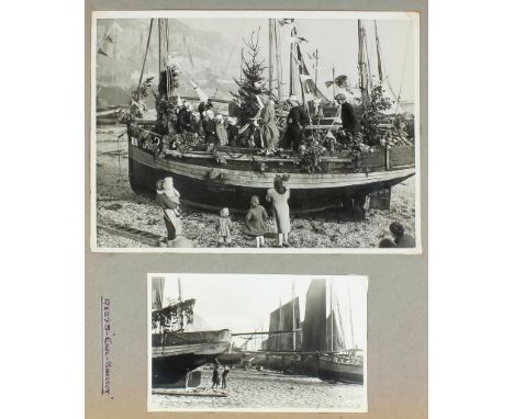 A photograph album containing a small archive of photographs primarily of Hastings fishing boats, two other small postcard al