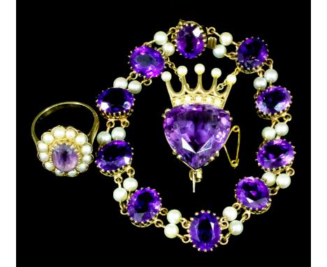 A 9ct gold mounted amethyst and seed pearl heart and Coronet pattern brooch, set with facet cut amethyst (approximately 8ct) 