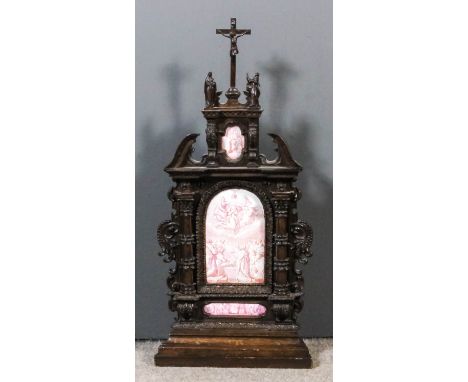 A 19th Century Continental carved walnut framed reliquary tabernacle in the Baroque manner, inset with three enamel plaques d