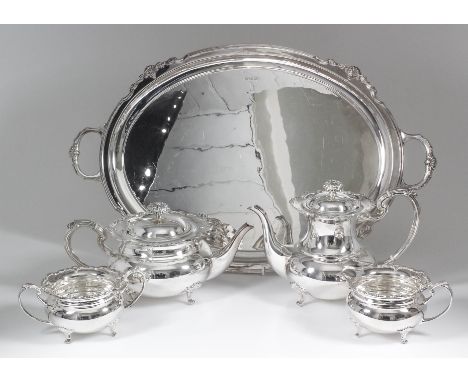 An Elizabeth II silver four-piece tea and coffee service with plain bulbous bodies, shaped and moulded rims, leaf pattern fin