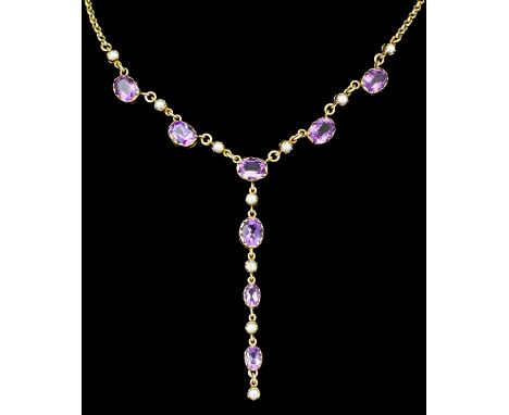 A 9ct gold mounted amethyst and seed pearl necklace, set with eight oval facet cut amethysts (total approximate weight 7ct) i