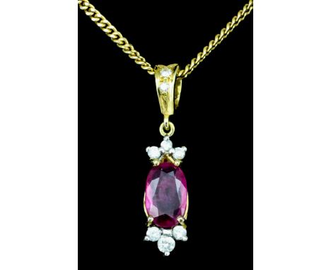 An 18ct gold mounted ruby and diamond pendant, set with an oval ruby (approximately .75ct) and eight small diamonds, 23mm dro