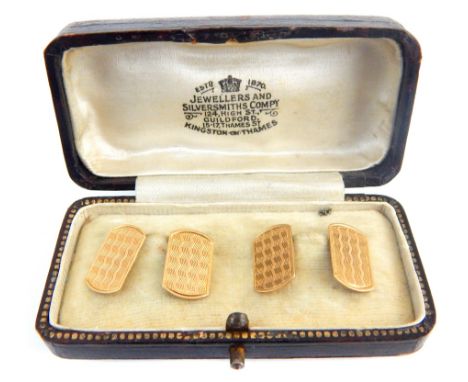 Pair of gold cufflinks with engine turned decoration, cased