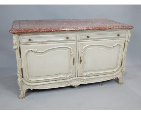 19th century French white painted commode, the moulded rouge marble top above an arrangement of two frieze drawers and pair o