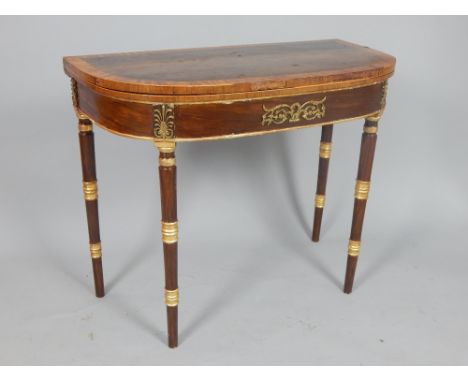 Late George III rosewood and satinwood cross banded card table, the rectangular D-shaped top above a frieze with gilt metal m