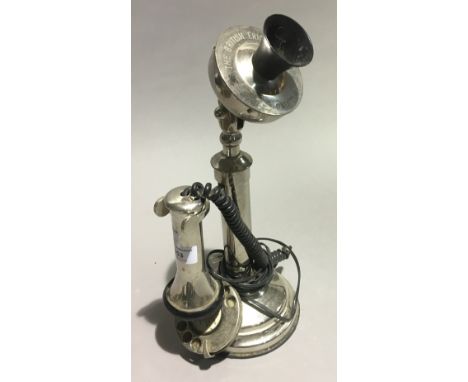 A candlestick telephone