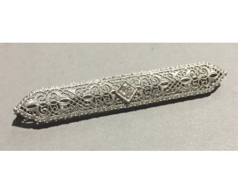 An Art Deco style diamond set 14 K gold brooch 
