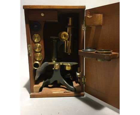A Victorian brass cased monocular microscope