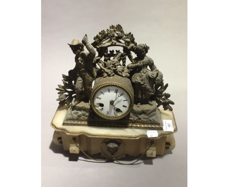 A Victorian figurally mounted mantle clock