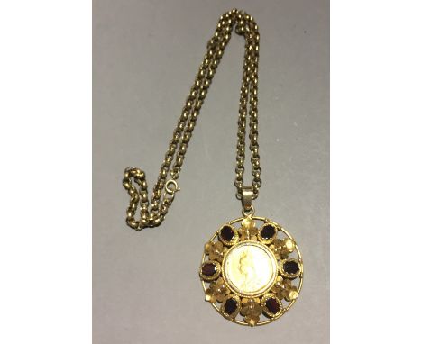 A Victorian gold sovereign, 1888, in amethyst set 9 ct gold frame on a 9 ct gold chain  (42 grammes all in)