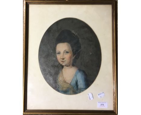 A framed oil portrait of a young lady