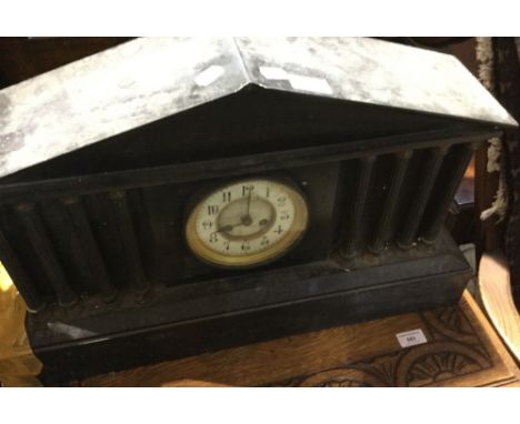 A Victorian black slate mantle clock