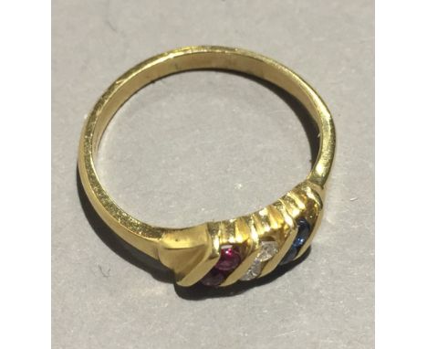 An 18 ct gold ruby, diamond and sapphire ring (3.7 grammes all in)