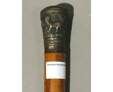 A 19th century walking stick with an Indian embossed metal knot 