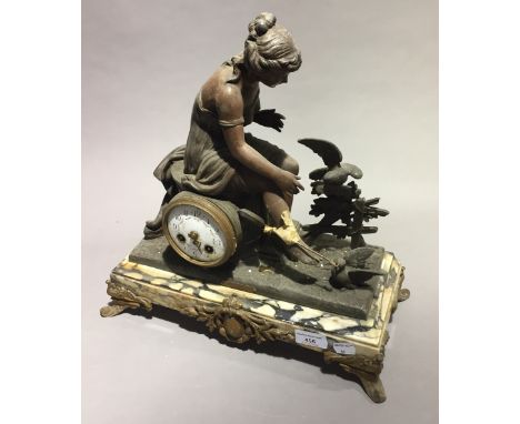 A Victorian figurally mounted marble mantle clock