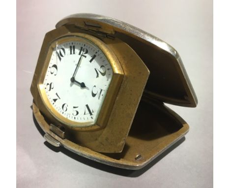 A silver cased travelling clock