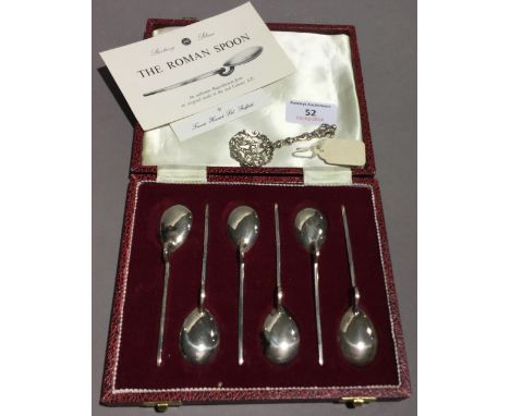 A set of six silver teaspoons and a caddy spoon
