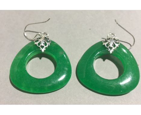 A pair of silver and jade earrings