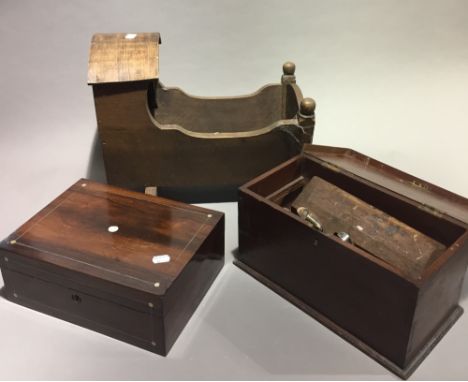 A Victorian mahogany box, tools and a dolls crib