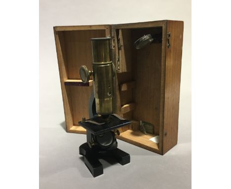 A cased student's microscope