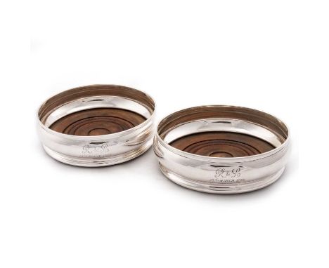 A PAIR OF ELIZABETH II SILVER COASTERS by J B Chatterley &amp; Sons Ltd, London 1971, circular form, engraved with initials a