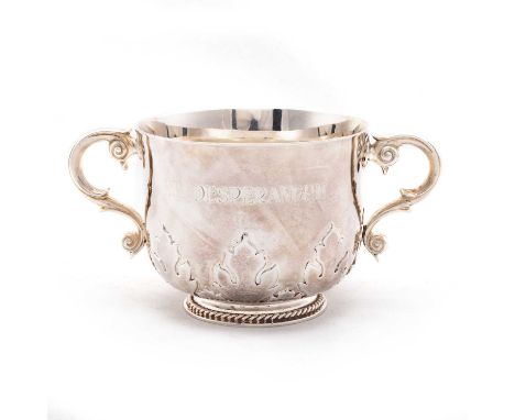 A VICTORIAN BRITANNIA STANDARD SILVER PORRINGER by George Fox, London 1897, circular with twin scroll-form handles, decorated