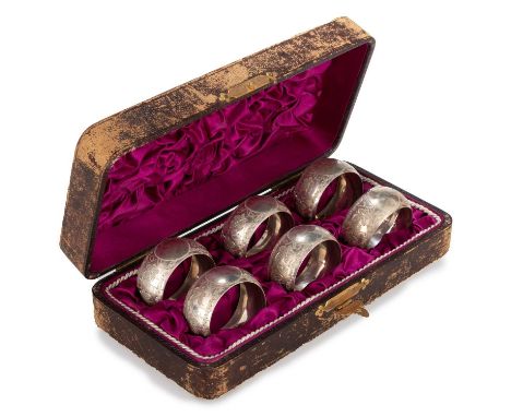 A SET OF SIX VICTORIAN SILVER NAPKIN RINGS by A E Robinson &amp; Co, Birmingham 1885, each circular, engraved with bands of l