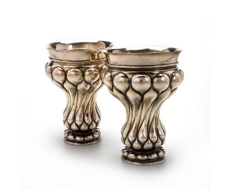 A PAIR OF LARGE CONTINENTAL SILVER BEAKERS bearing pseudo-Russian marks for Ivan Lakomkin, Alderman I I Vereshchagin, Assay M