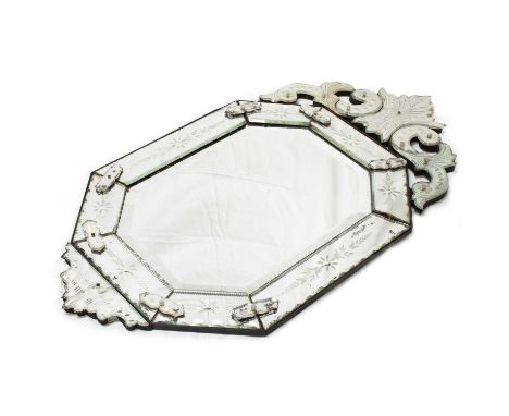 A VENETIAN MIRROR, LATE 19TH CENTURY the central canted rectangular bevelled plate with a foliate pediment and etched margin-