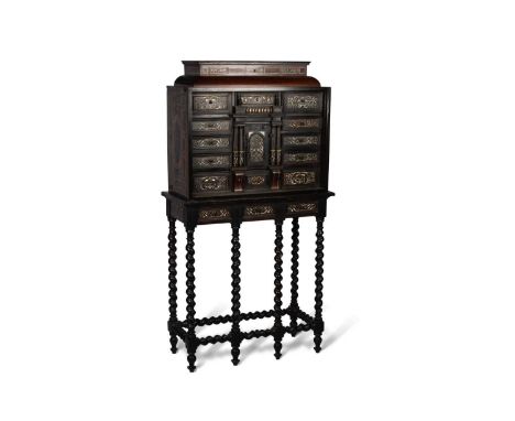 A LATE 17TH CENTURY EBONISED AND IVORY-INLAID CABINET ON STAND  § in two parts, the caddy top with a hinged box, above an arr