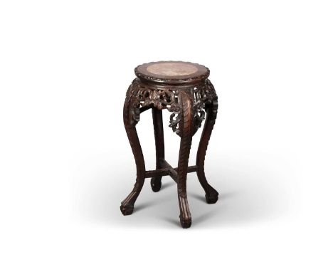A CHINESE MARBLE-INSET HARDWOOD PLANTSTAND, LATE 19TH CENTURY the circular top with a leaf-carved edge, above a pierced and f